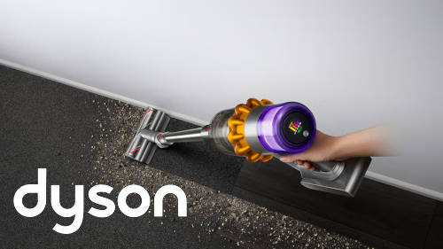 A handheld Dyson vacuum cleaner in use